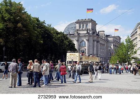Tourists sitting in sightseeing bus on road, Berlin, Germany View Large Photo Image Stock Photo - Tourists sitting in sightseeing bus on road, Berlin, Germany . Fotosearch