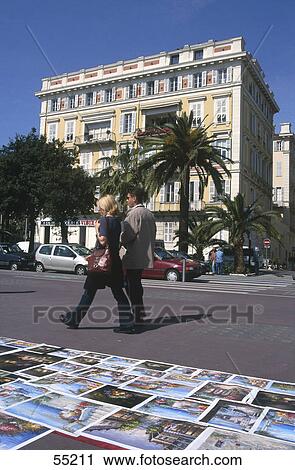 Tourists walking on roadside, Nice, France View Large Photo Image Stock Image - Tourists walking on roadside, Nice, France . Fotosearch