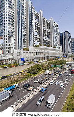 Traffic road in front of the Fuji TV building, Tokyo, Japan View Large Photo Image Stock Photograph - Traffic road in front of the Fuji TV building, Tokyo, Japan . Fotosearch