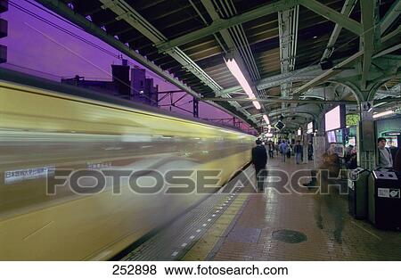 Train in motion at metro station, Tokyo Prefecture, Japan View Large Photo Image Stock Photo - Train in motion at metro station, Tokyo Prefecture, Japan . Fotosearch