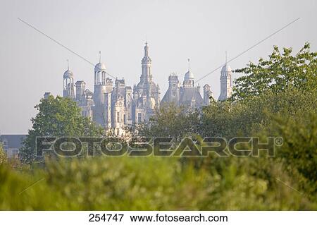 Stock Photo - Trees in front of castle, Chateau De Chambord, Loir-Et-Cher, France . Fotosearch