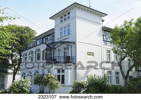 Stock Photo - Trees in front of residential building, Ostseebad Binz, Ruegen, Mecklenburg-Western Pomerania, Germany . Fotosearch