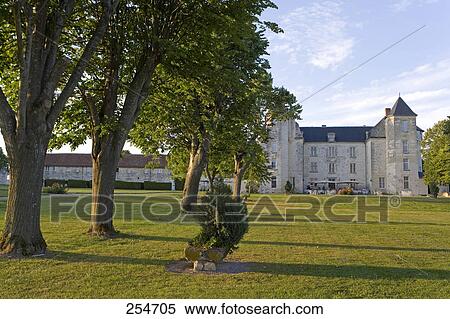 Stock Photography - Trees in lawn in front of castle, Chateau De Marcay, Indre-Et-Loire, France . Fotosearch