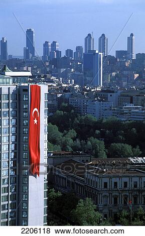 Turkish flag hung on building in city View Large Photo Image Stock Photo - Turkish flag hung on building in city . Fotosearch