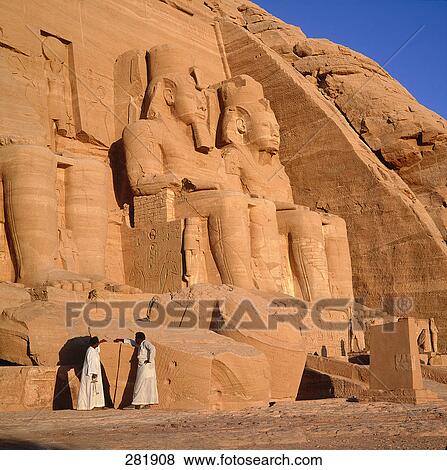 Two people at ancient Egyptian temple, Great Temple of Rameses II, Lake Nasser, Abu Simbel, Egypt View Large Photo Image Stock Photo - Two people at ancient Egyptian temple, Great Temple of Rameses II, Lake Nasser, Abu Simbel, Egypt . Fotosearch