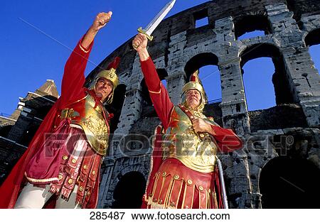 Two people in roman soldier costume in front of amphitheater, Rome, Italy View Large Photo Image Stock Photo - Two people in roman soldier costume in front of amphitheater, Rome, Italy . Fotosearch