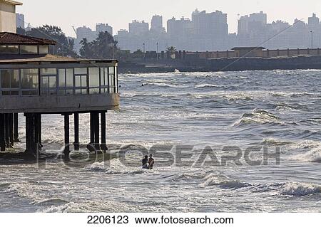 Stock Image - Two people on beach . Fotosearch