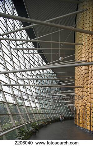 Stock Image - Two people standing inside modern building . Fotosearch