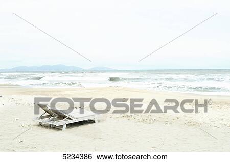 Two sun loungers at beach, South Chinese Ocean, Mui Ne, Vietnam, Asia View Large Photo Image Stock Photograph - Two sun loungers at beach, South Chinese Ocean, Mui Ne, Vietnam, Asia . Fotosearch