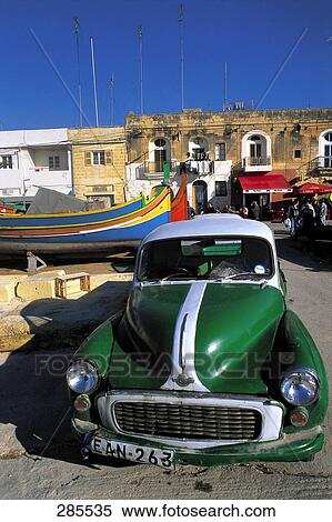 Stock Photography - Vintage car at harbor, Malta . Fotosearch