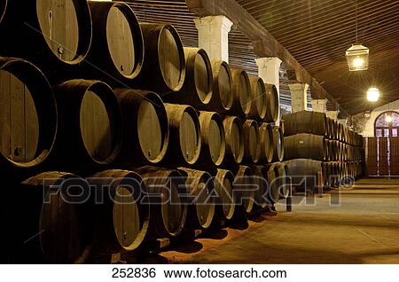 Stock Photograph - Wine barrel inside cellar, Jerez De La Frontera, Andalusia, Spain . Fotosearch