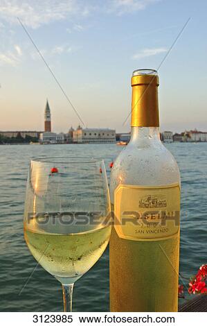 Wine glass next to a bottle, Venice, Italy, close-up View Large Photo Image Stock Photography - Wine glass next to a bottle, Venice, Italy, close-up . Fotosearch