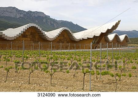 Stock Image - Winery buildung and vineyard, Laguardia, Spain . Fotosearch