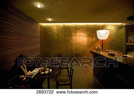 Woman reading menu card in bar, Design Hotel Greulich, Zurich, Switzerland View Large Photo Image Stock Image - Woman reading menu card in bar, Design Hotel Greulich, Zurich, Switzerland . Fotosearch