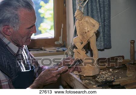 Wood sculptor making sculpture in workshop, Tyrol, Austria View Large Photo Image Stock Image - Wood sculptor making sculpture in workshop, Tyrol, Austria . Fotosearch