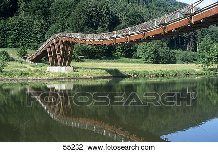 Stock Image - Wooden bridge across river, Altmuhl River, Bavaria, Germany . Fotosearch
