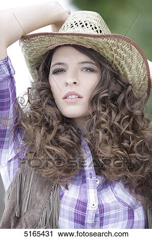 Young woman as cowgirl View Large Photo Image Stock Image - Young woman as cowgirl . Fotosearch