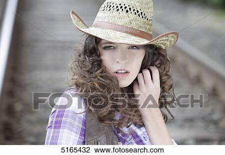 Young woman as cowgirl View Large Photo Image Stock Image - Young woman as cowgirl . Fotosearch