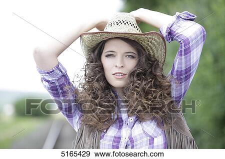 Stock Photo - Young woman as cowgirl . Fotosearch