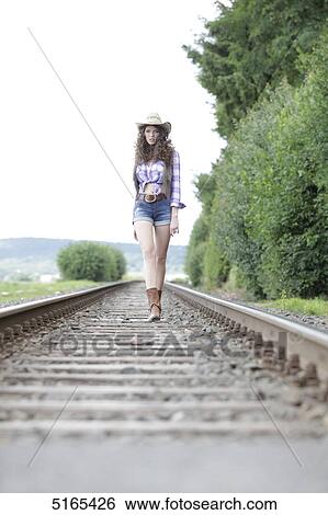 Young woman as cowgirl View Large Photo Image Stock Photograph - Young woman as cowgirl . Fotosearch