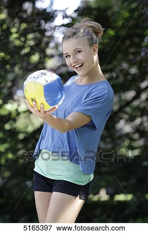 Young woman playing with ball View Large Photo Image Stock Photo - Young woman playing with ball . Fotosearch