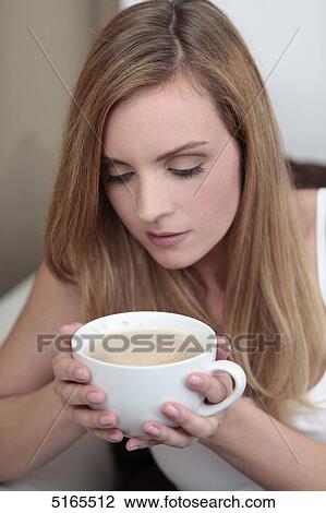 Young woman with cup of coffee View Large Photo Image Stock Image - Young woman with cup of coffee . Fotosearch