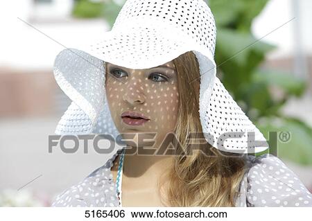 Young woman with white hat View Large Photo Image Stock Photograph - Young woman with white hat . Fotosearch