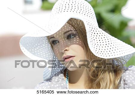 Young woman with white hat View Large Photo Image Stock Photography - Young woman with white hat . Fotosearch