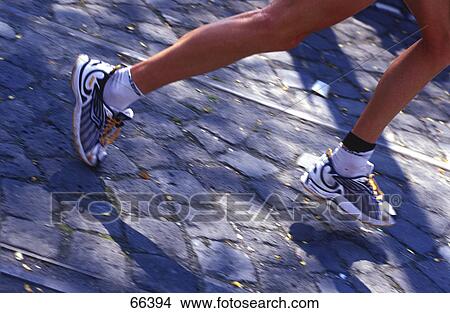 Picture - Athlete running in marathon . Fotosearch