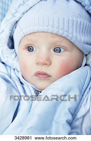 Baby wearing a blue cap and jacket, portrait View Large Photo Image Stock Image - Baby wearing a blue cap and jacket, portrait . Fotosearch