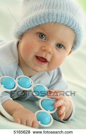Stock Photo - Baby with wooly hat . Fotosearch