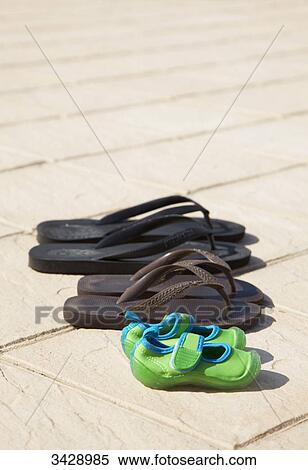 Bathing shoes in a row View Large Photo Image Stock Photography - Bathing shoes in a row . Fotosearch