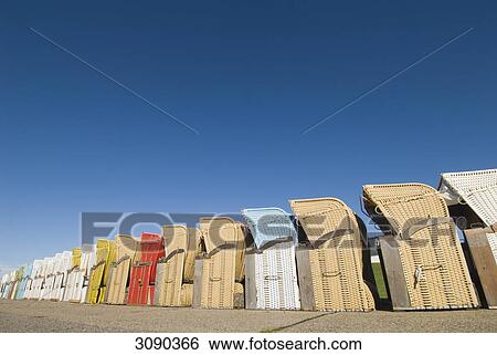 Beach chairs in a row, Dagebuell, Schleswig-Holstein, Germany View Large Photo Image Stock Photograph - Beach chairs in a row, Dagebuell, Schleswig-Holstein, Germany . Fotosearch