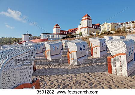 Stock Image - Beach with beach chairs and sanatorium in Binz, Ruegen, Germany . Fotosearch