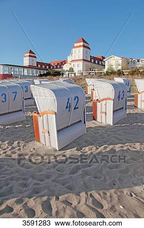 Beach with beach chairs and sanatorium in Binz, Ruegen, Germany View Large Photo Image Stock Image - Beach with beach chairs and sanatorium in Binz, Ruegen, Germany . Fotosearch