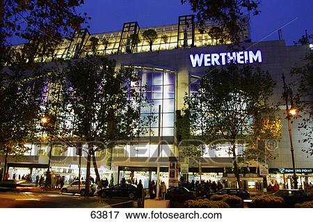 Building of shopping mall illuminated at night, Berlin, Germany, Europe View Large Photo Image Stock Photo - Building of shopping mall illuminated at night, Berlin, Germany, Europe . Fotosearch