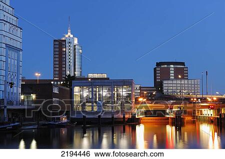 Buildings lit up at dusk, Hanseatic Trade Center, Schaartorbruecke, Schleusenhaus, Hamburg, Germany View Large Photo Image Stock Photograph - Buildings lit up at dusk, Hanseatic Trade Center, Schaartorbruecke, Schleusenhaus, Hamburg, Germany . Fotosearch