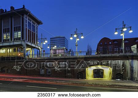 Stock Photo - Buildings lit up at dusk, Oberbaumcity, Berlin, Germany . Fotosearch