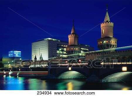 Buildings lit up in city at night, Oberbaumbrucke, Spree River, Berlin, Germany View Large Photo Image Picture - Buildings lit up in city at night, Oberbaumbrucke, Spree River, Berlin, Germany . Fotosearch