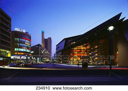 Stock Image - Buildings lit up in city at night, Berlin, Germany . Fotosearch