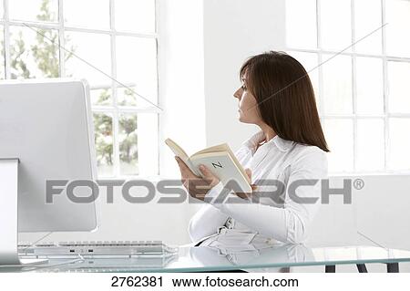 Businesswoman looking through window View Large Photo Image Stock Image - Businesswoman looking through window . Fotosearch