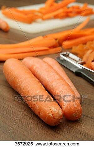 Stock Photography - Carrots and peeler . Fotosearch