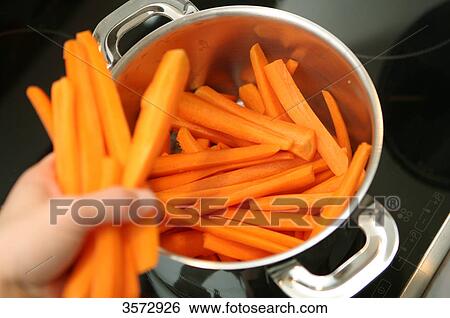 Carrots cooking in pot View Large Photo Image Stock Photograph - Carrots cooking in pot . Fotosearch