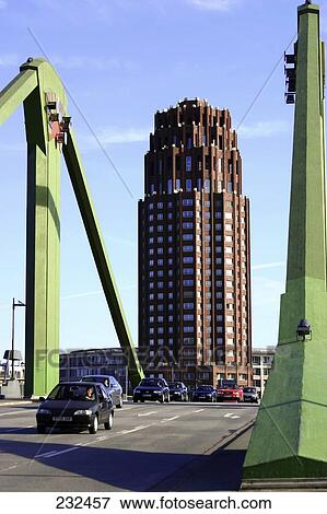 Stock Photo - Cars moving on bridge with hotel in background, Ignatz-Bubis bridge, Frankfurt, Germany . Fotosearch