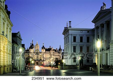 Stock Image - Castle lit up at dusk, Schwerin, Mecklenburg Western-Pomerania, Germany . Fotosearch