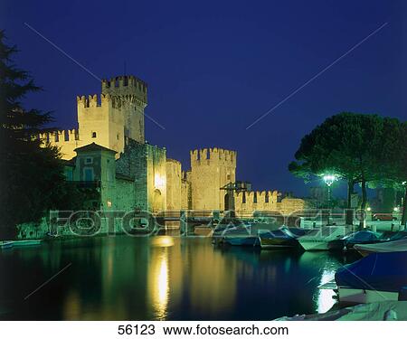 Stock Image - Castle lit up at night, Scaligers Castle, Simione, Lombardy, Italy . Fotosearch