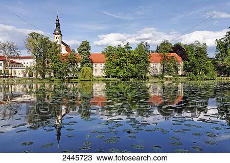 Church at waterfront, Niederlausitz, Brandenburg, Germany View Large Photo Image Stock Image - Church at waterfront, Niederlausitz, Brandenburg, Germany . Fotosearch