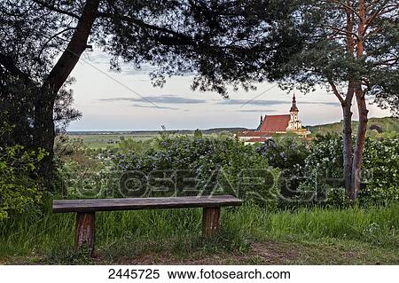 Stock Photography - Church surrounded by trees, Niederlausitz, Priorsberg, Brandenburg, Germany . Fotosearch