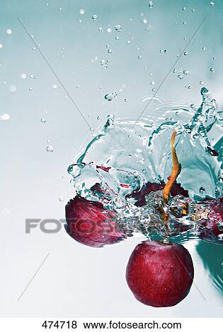 Close-up of berries dipping in water View Large Photo Image Stock Photo - Close-up of berries dipping in water . Fotosearch
