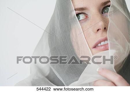 Close-up of bride wearing a veil View Large Photo Image Stock Image - Close-up of bride wearing a veil . Fotosearch